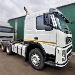 Volvo FM 400 6x4 truck tractor right side showing aluminium fuel tank, air suspension, ready to work